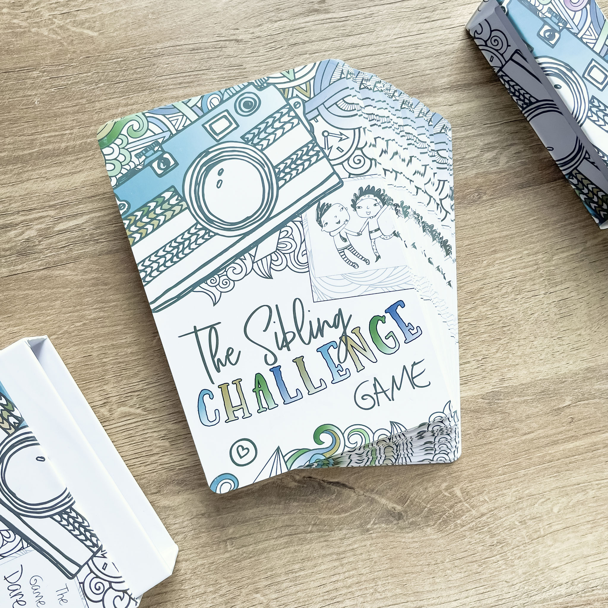 The Sibling Challenge Game cards on a table
