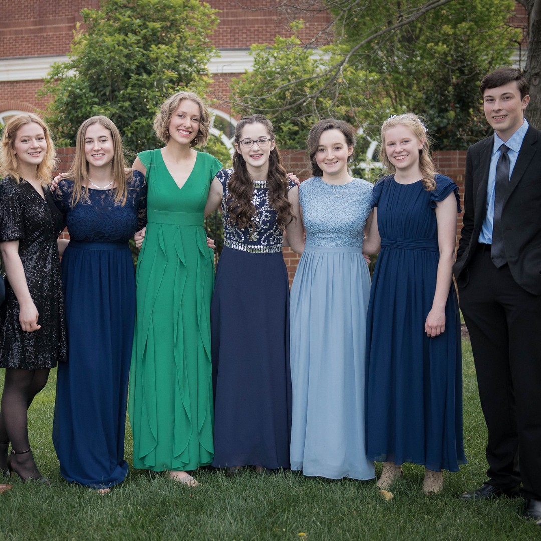 homeschool teens dressed for prom standing together
