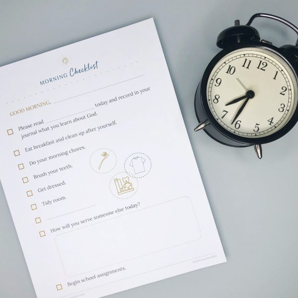 A printed morning routine checklist and a clock